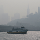 The skyline is obscured by smoke and haze from wildfires as a tour boat makes its way along the waterfront Thursday, Nov. 15, 2018, in San Francisco. Recurring wildfires are sparking concern among medical experts about potentially major health consequences. Worsening asthma, lung disease and even heart attacks in heart disease patients have all been linked with previous fires. But blazes that used to be seasonal are happening nearly year-round and increasingly spreading into cities. That's exposing many more people to choking smoke that contains many of the same toxic ingredients as urban air pollution. (AP Photo/Eric Risberg)